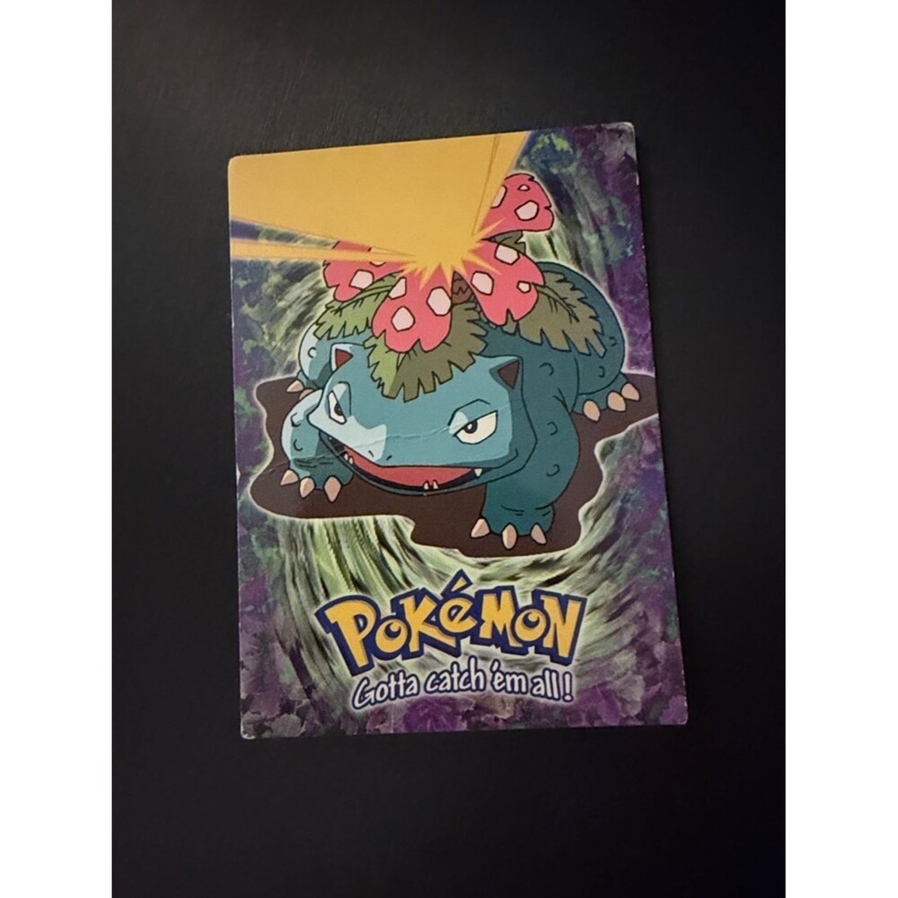 Topps Pokémon Card with Blue, Green, Pink and Yellow Artwork
